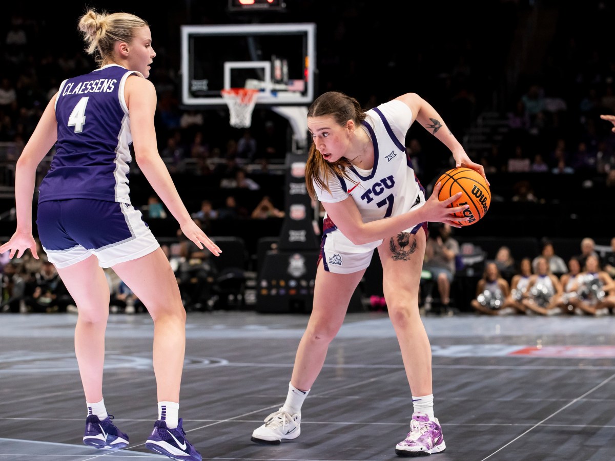 TCU Horned Frogs forward Marta Suárez prepares to maneuver around Kansas State Wildcats forward Nastja Claessens.