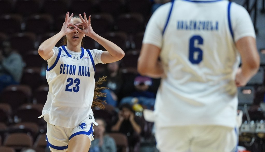 Jordana Codio celebrates a 3-pointer by posing with the three fingers celebration above both eyes