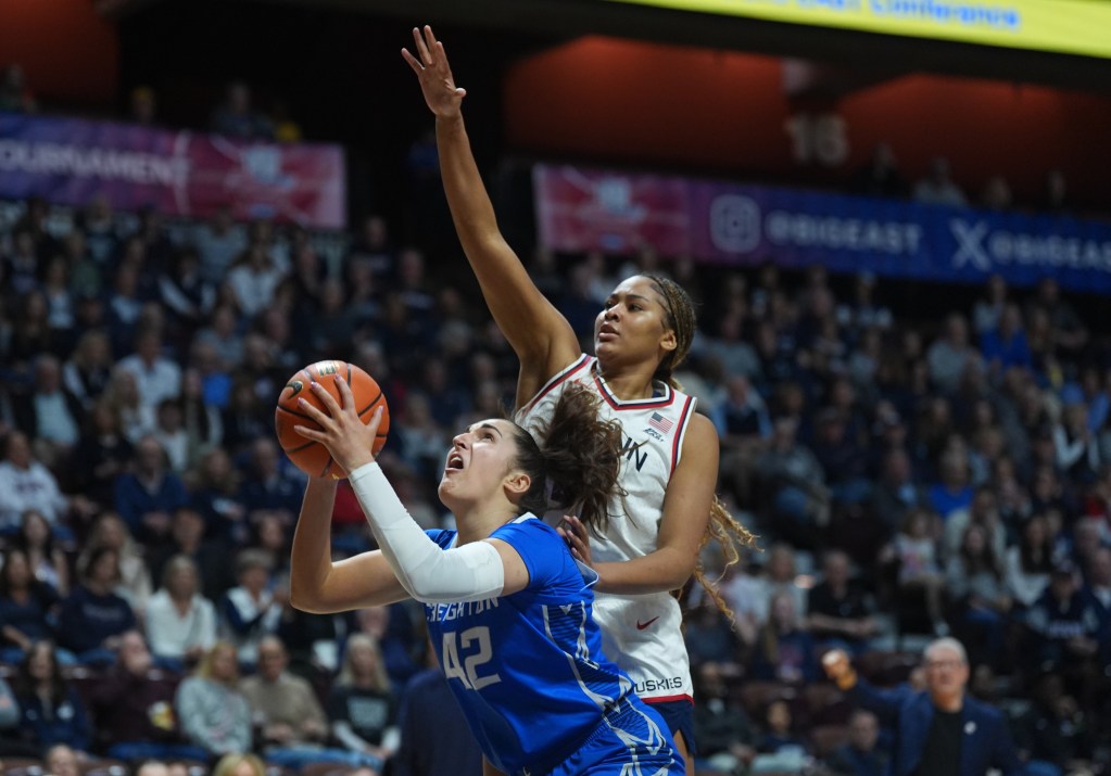 With an outstretched hand, Sarah Strong defends <a rel=