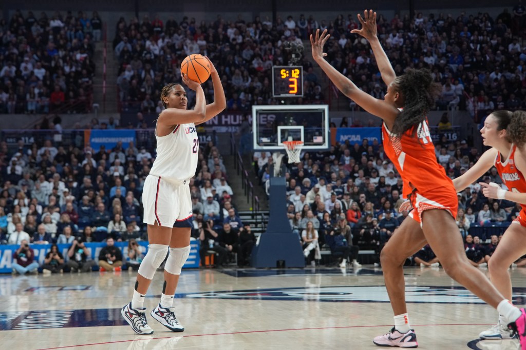 Sarah Strong shoots a 3-pointer over the outstretched arms of a Syracuse defender