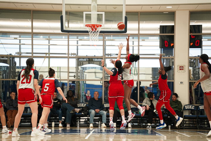 Two USA Basketball players contest at the rim during a recent training camp at Duke University.
