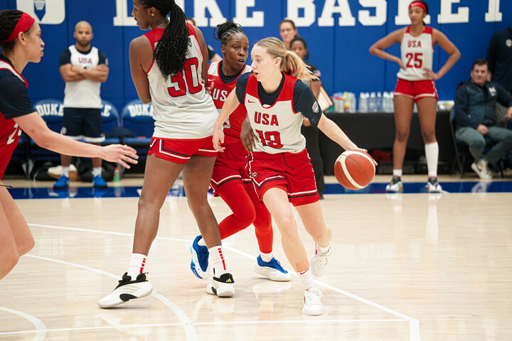 Paige Bueckers controls the ball along the three-point arc during a recent USA Basketball training camp at Duke University.