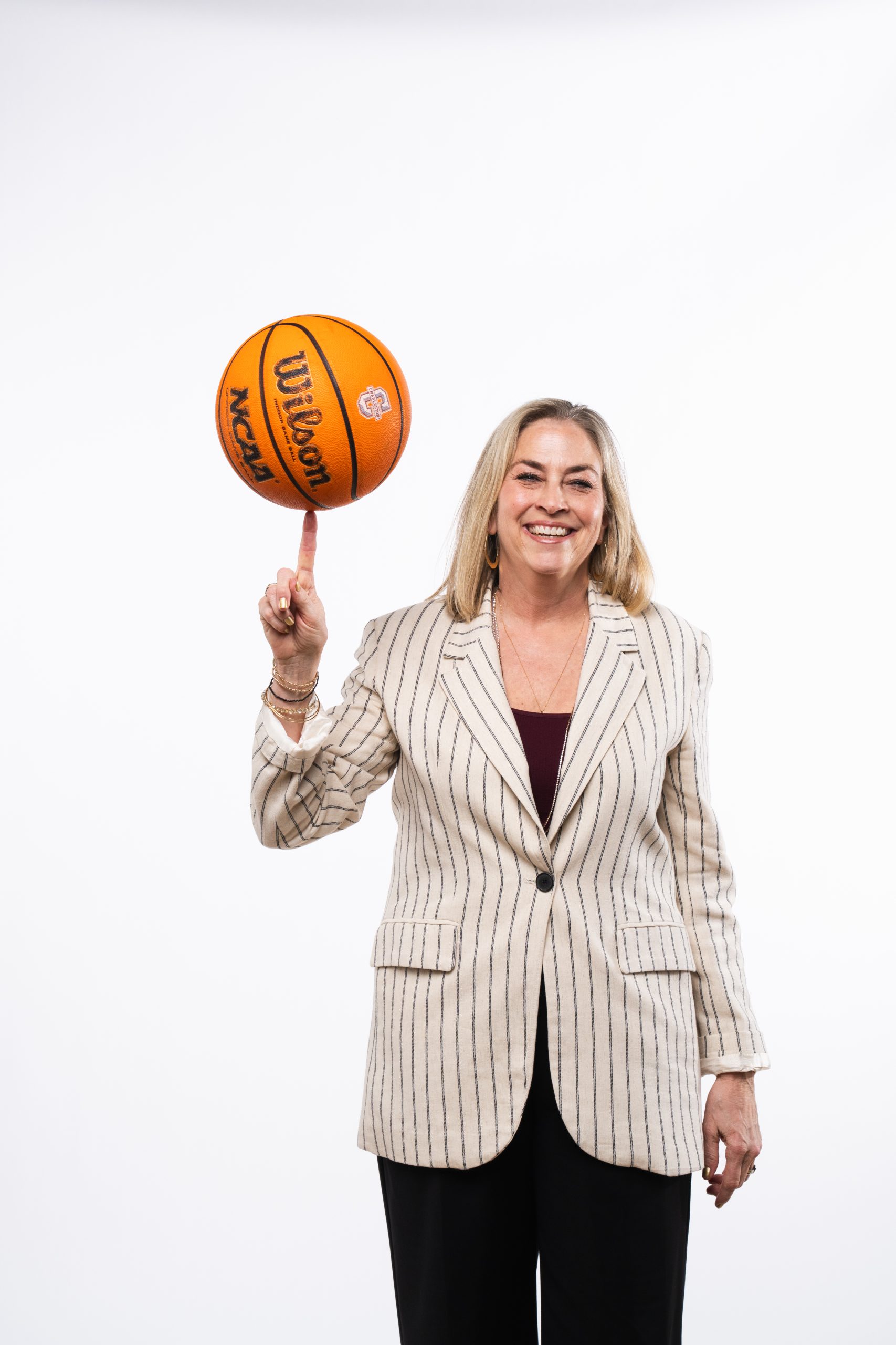 First-year College of Charleston head coach Amanda Butler balances a ball on her finger.