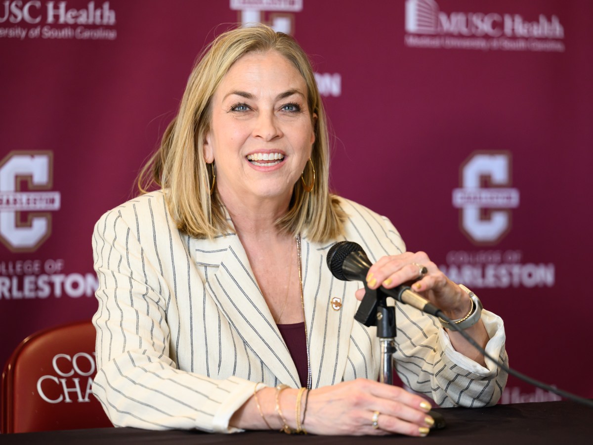 College of Charleston head coach Amanda Butler smiles before she answers a question during a press conference.