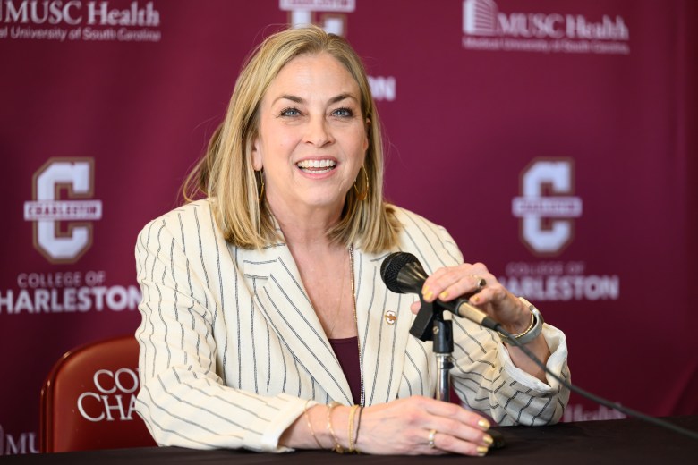 College of Charleston head coach Amanda Butler smiles before she answers a question during a press conference.