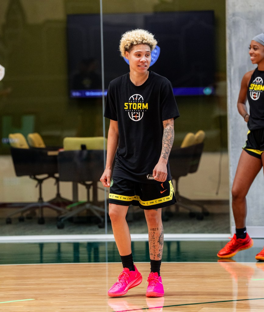 Natisha Hiedeman stands on the court with her arms at her sides during the first day of training camp.