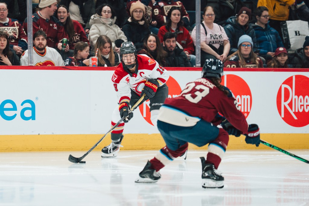 On-ice action between and Ottawa and Montreal skater