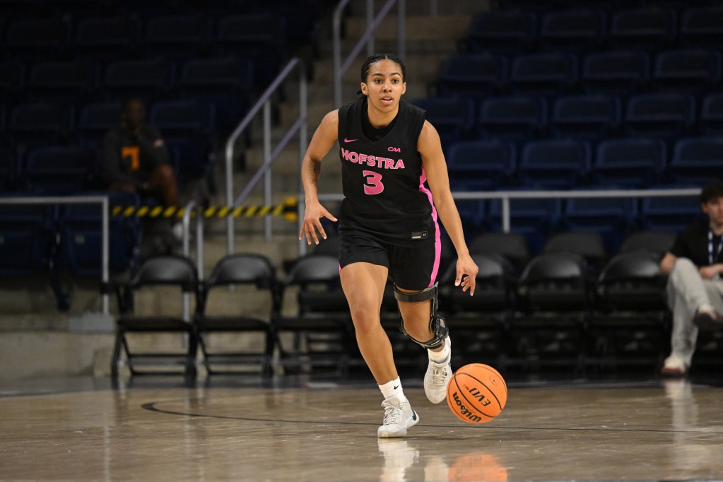 Hofstra's Chloe Sterling dribbles a CAA tournament game agianst Drexel.