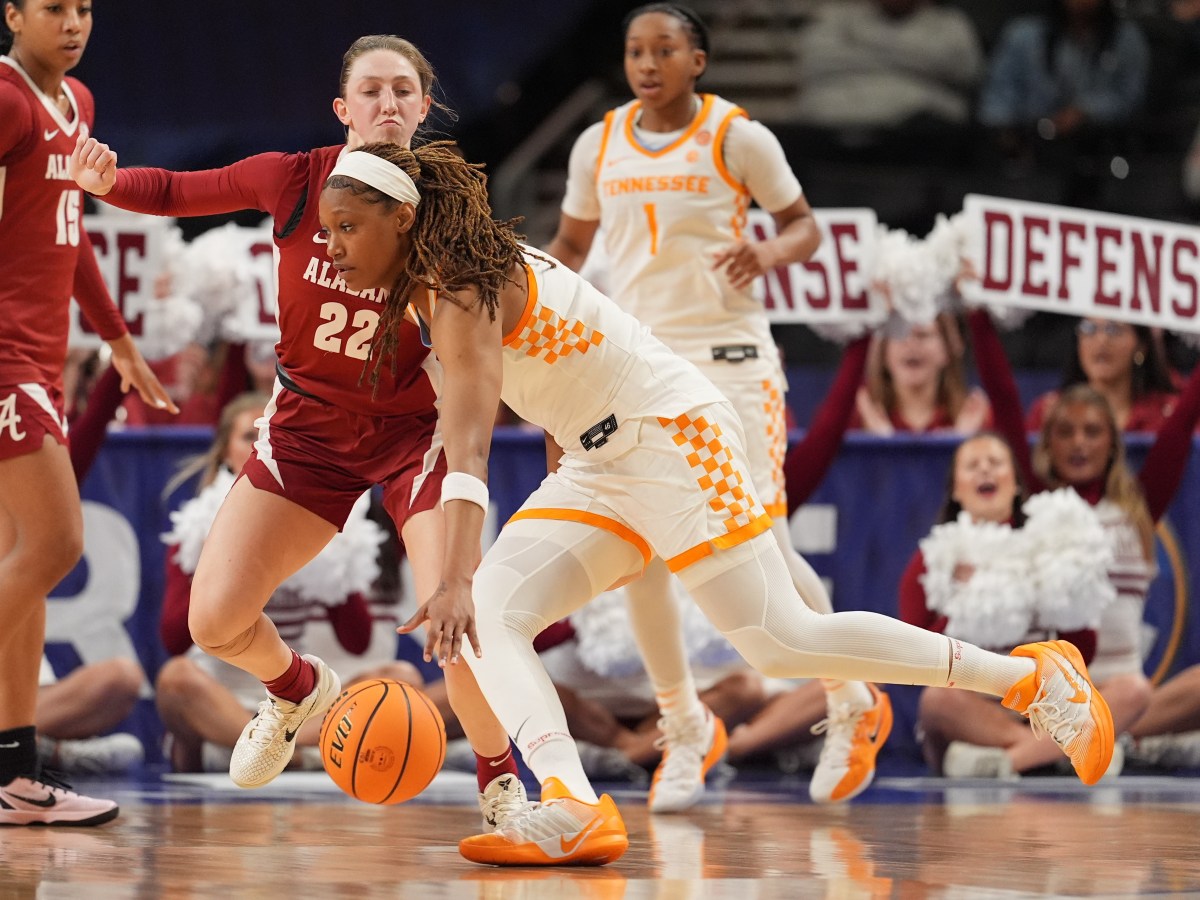 Janiah Barker (0) drives towards the net against Alabama guard Karly Weathers (22).