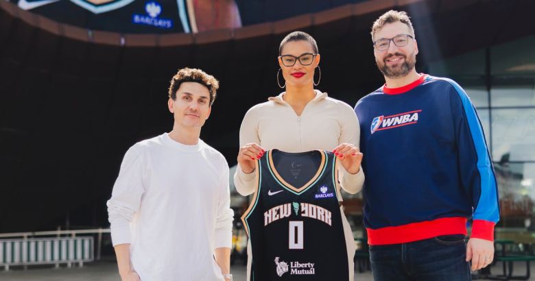 Liberty GM Jonathan Kolb, Satou Sabally and Chris DeMarco stand outside of the Barclays Center together. Sabally holds her new black Liberty jersey.