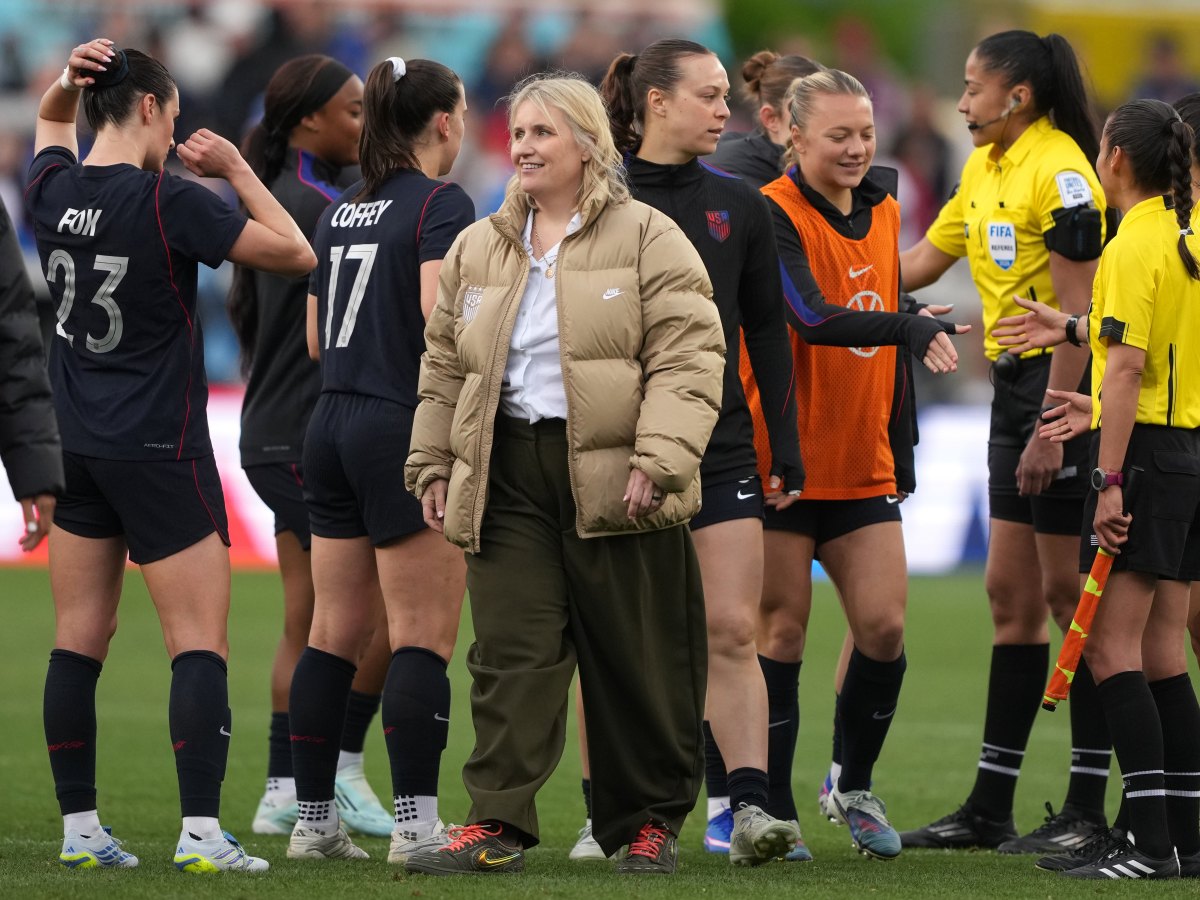 U.S. women's national team coach Emma Hayes is surrounded by her players