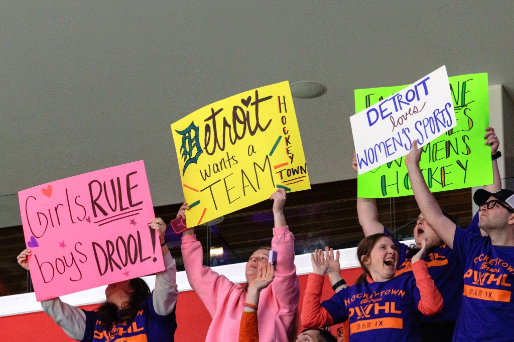 Fans hold up "Detroit wants a team" sign at March 2026 Take Over Game