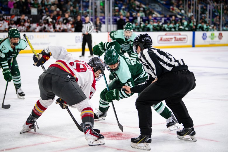 Brianne Jenner & Alina Muller line up for a faceoff in PWHL playoff action.