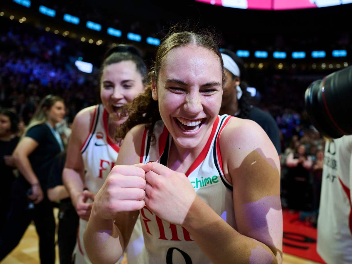 Portland, Oregon, Portland Fire guard Carla Leite (0) celebrates with teammates after a game against New York Liberty at Moda Center