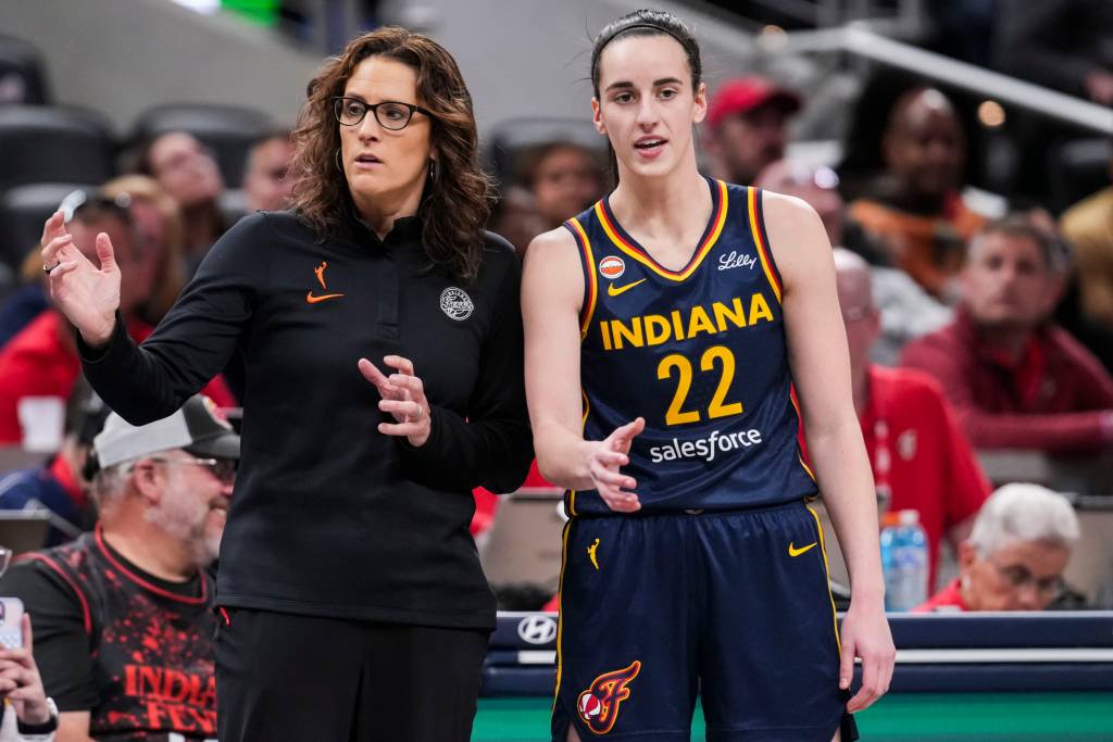 Indiana Fever head coach Stephanie White talks with Indiana Fever guard Caitlin Clark (22) on Saturday, May 2, 2026.