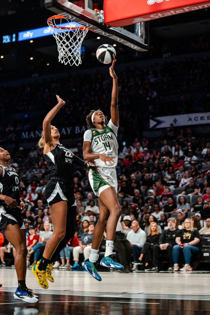 Dominique Malonga goes up for a layup with her left hand as <a rel=
