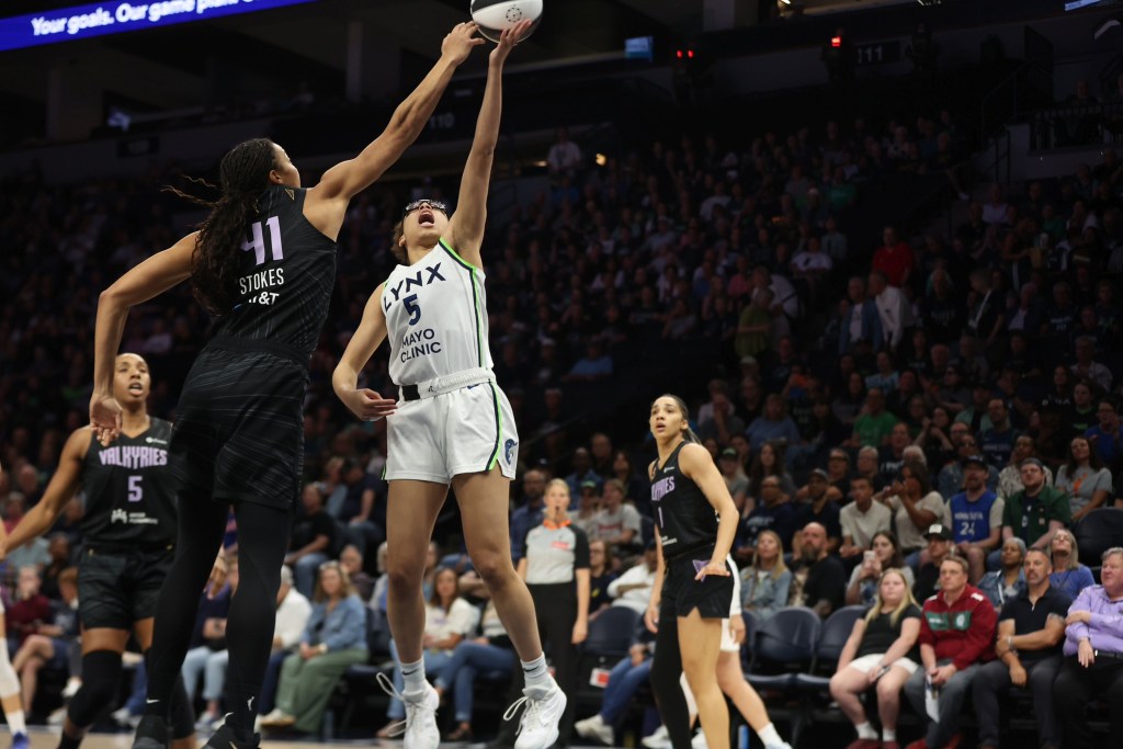 Golden State Valkyries center Kiah Stokes contests a shot from Minnesota Lynx guard <a rel=