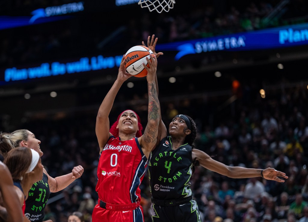 Seattle Storm guard Flau'jae Johnson is behind Washington Mystics center <a rel=