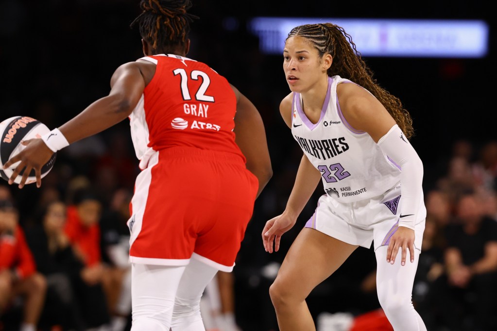 Golden State Valkyries guard Veronica Burton defends against Las Vegas Aces guard Chelsea Gray. Burton is shown from the front while Gray is seen from the back.