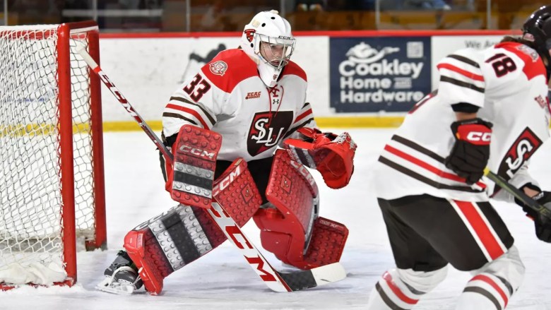 Emma-Sofie Nordstrom tends goal in her home white jersey for St. Lawrence