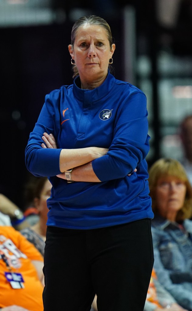 Minnesota Lynx head coach Cheryl Reeve watches with her arms crossed as she gazes on and watches the game from the sideline as the Lynx ton the Connecticut Sun at Mohegan Sun Arena.