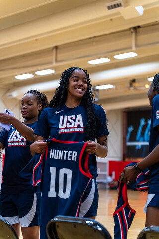 Maliya Hunter holds her new USA Basketball jersey at the team's training camp. 
