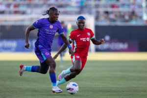 Temwa Chawinga guarding Barbra Banda as she advances the ball.