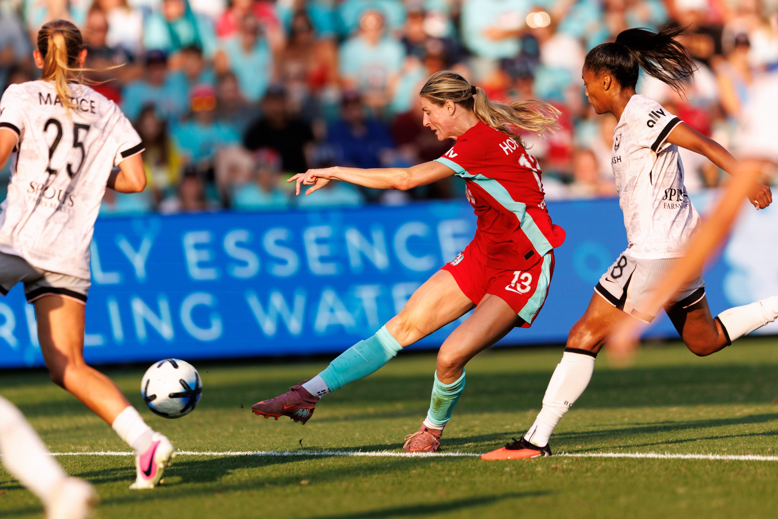 Haley Hopkins fires a shot with her right foot.