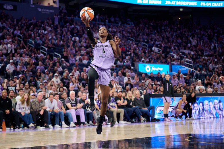 Kaila Charles launches off her right foot for a layup.