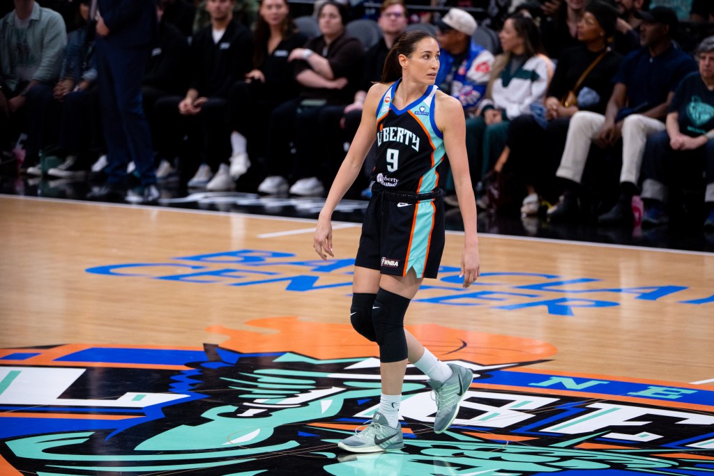 Rebecca Allen stands while on the center court during a throw back court origins night at Barclays Center