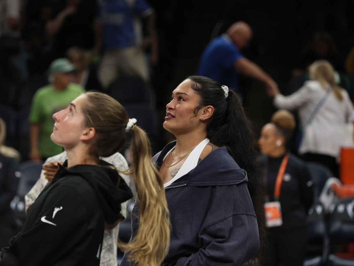 Kate Martin in pre-game warm-up and Alissa Pilli in street clothes