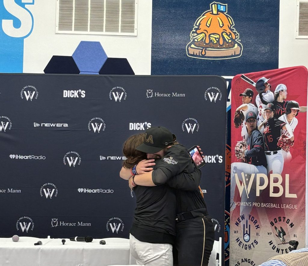 Maggie Foxx embraces her mother, Jennifer