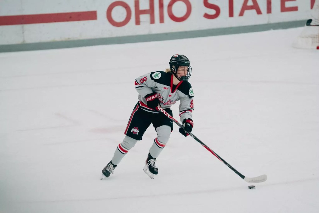 Hilda Svensson skates with the puck.