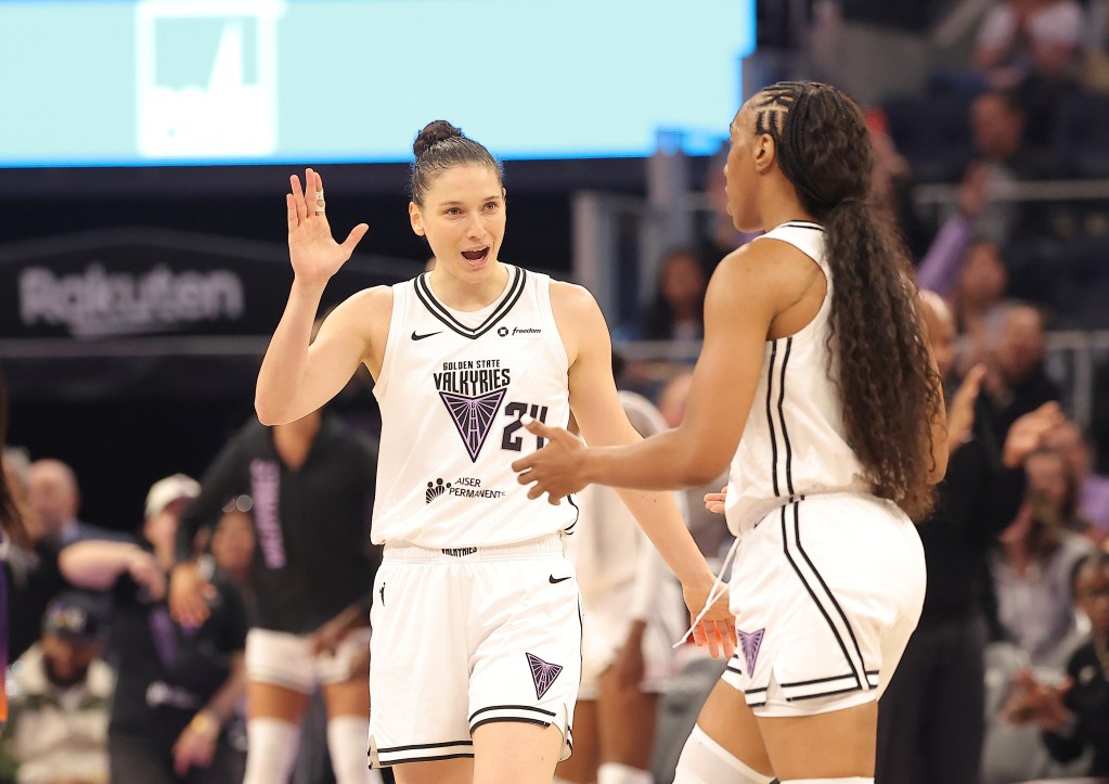 Golden State Valkyries forward Cecilia Zandalasini (24) celebrate with forward Kayla Thornton (5) after a basket against the Phoenix Mercury during the first quarter at Chase Center.