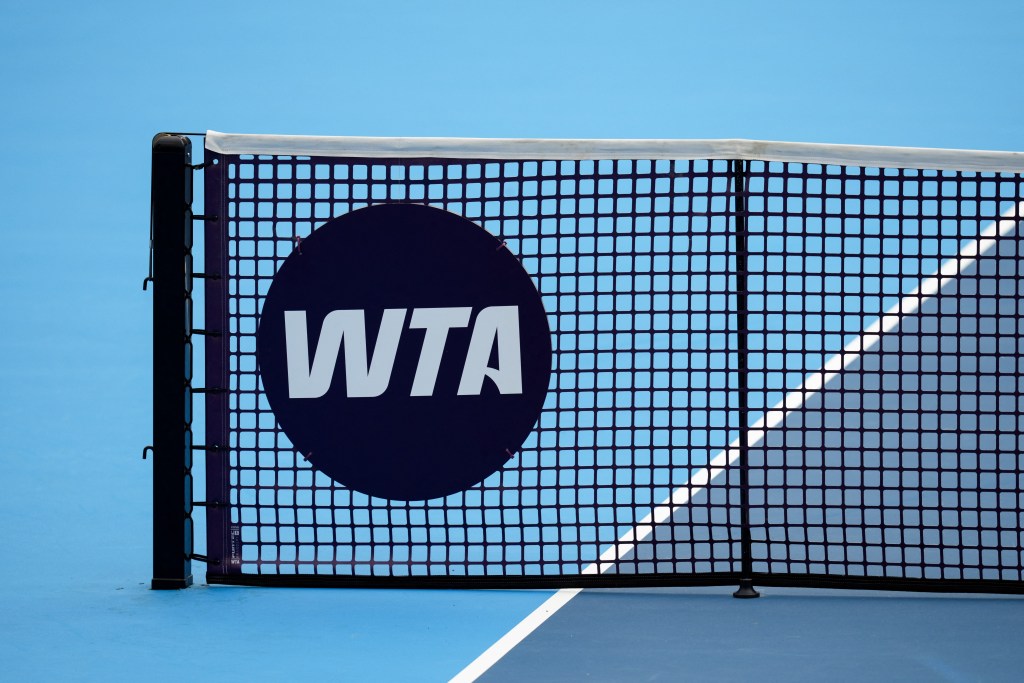 A picture of a tennis net with the WTA logo on it