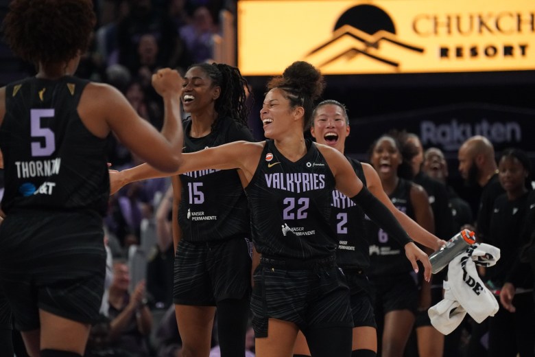 Golden State Valkyries guard Veronica Burton (22), guard Tiffany Hayes (15), and guard Kaitlyn Chen (2) high-five their teammates.