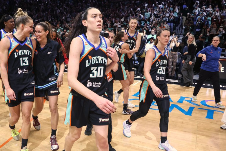 Breanna Stewart, Sabrina Ionescu, Leonie Fieibich, Rebecca Allen, Jonquel Jones, Han Xu and Anneli Maley walk off the court after defeating the Minnesota Lynx and moving onto the WNBA semifinals.