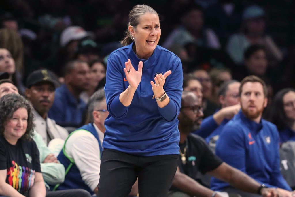 Cheryl Reeve coaches from the sideline with her hands while at Barclays Center