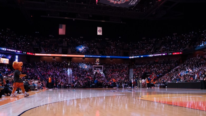 The Connecticut Sun fans light up the arena with their phone flashlights.