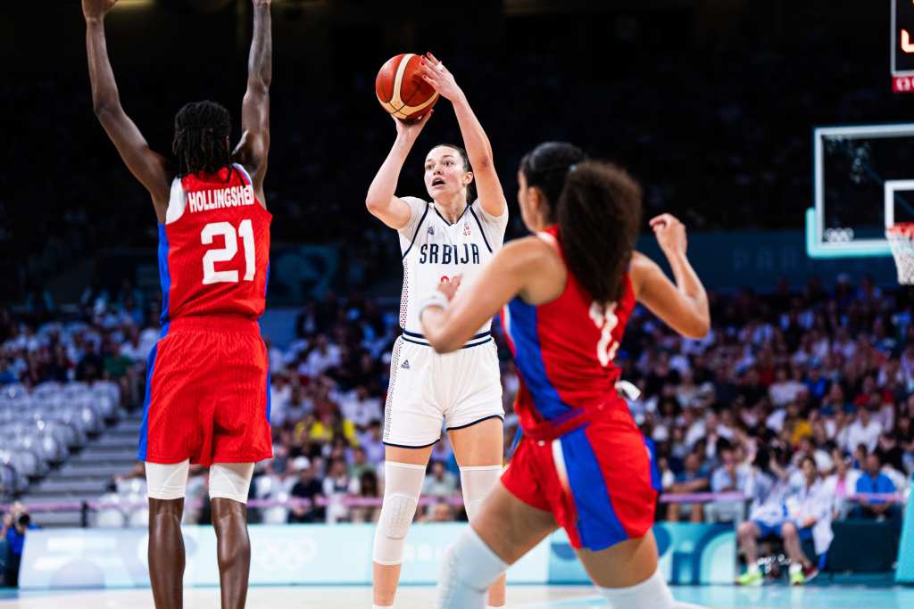 Serbia forward Angela Dugalić shoots a right-handed jump shot as a Puerto Rico defender tries to close out on her.