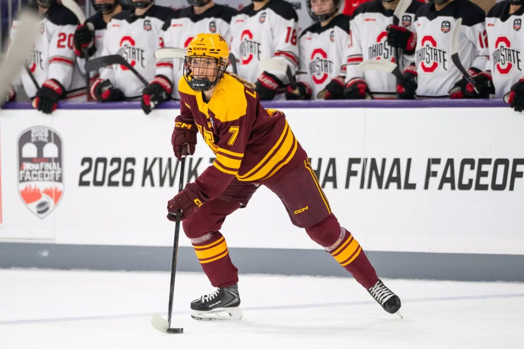 Nelli Laitinen handles the puck for the University of Minnesota.