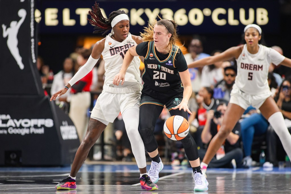 Sabrina Ionescu dribbles the ball with <a rel=