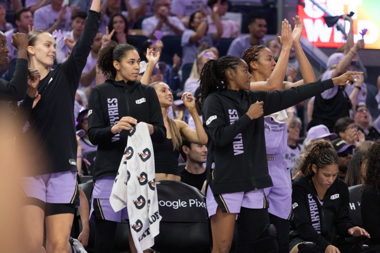 Valkryies bench players celebrate the team's win over Dallas in the WNBA Playoffs.