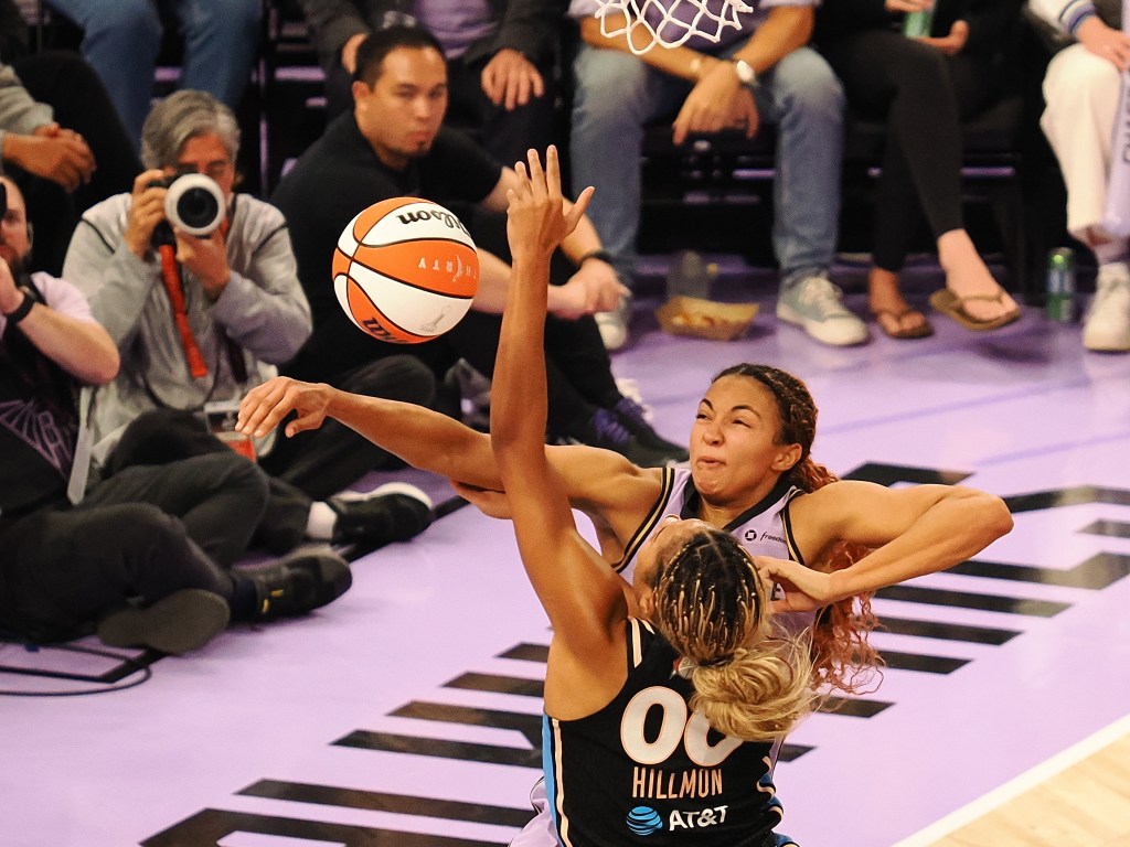 Kiah Stokes blocks a shot.