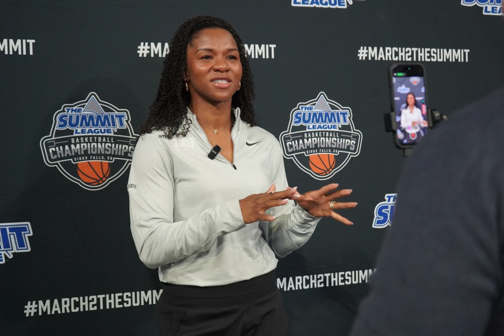 Oral Roberts head coach Cophie Anderson talks to the media during 2026 Summit League media day.