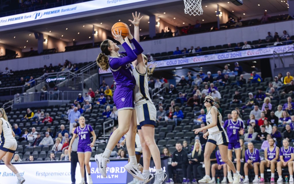St. Tomas (MN) junior Alyssa Sand shoots over defenders during the 2026 Summit League Tournament in Sioux Falls, SD.