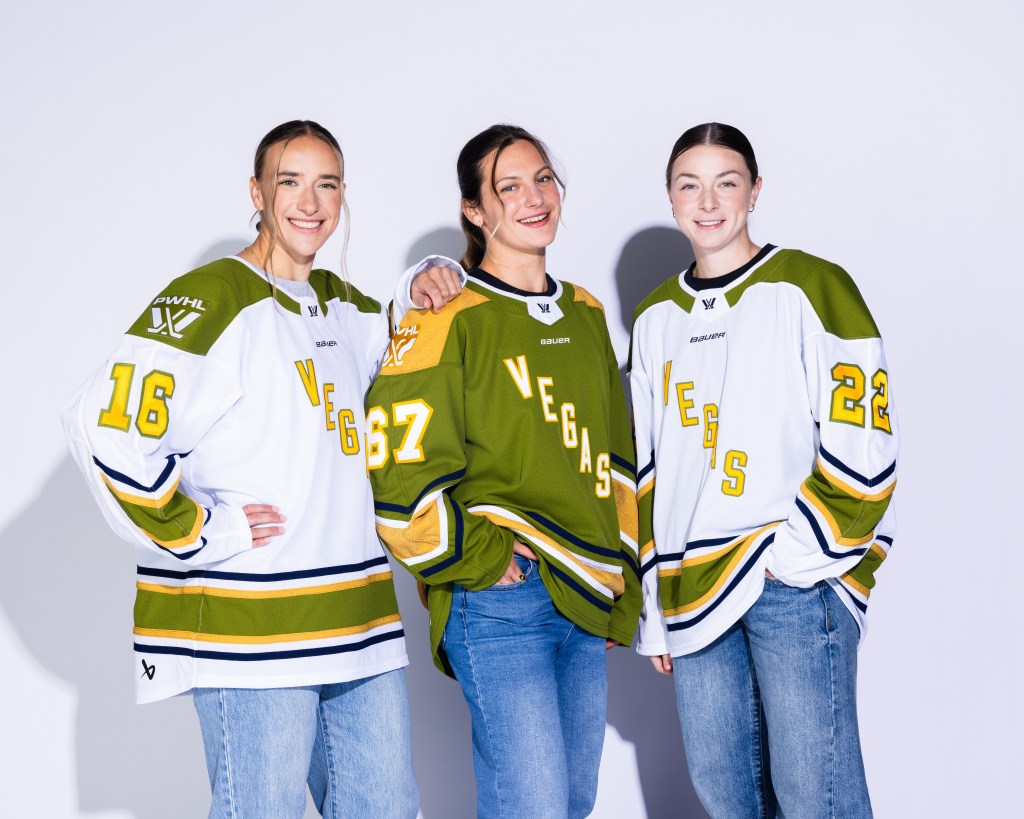 Photo of Hayley Scamurra, Lacey Eden & Tessa Janecke modeling the inaugural Las Vegas jerseys.