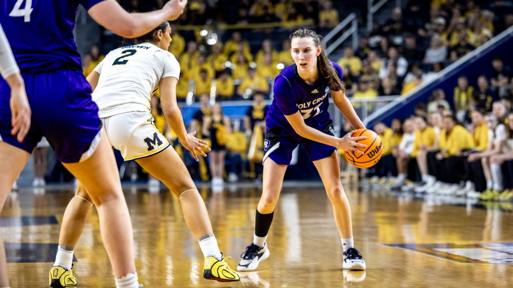 Kendall Eddy fakes left and looks right as she looks to drive to the basket